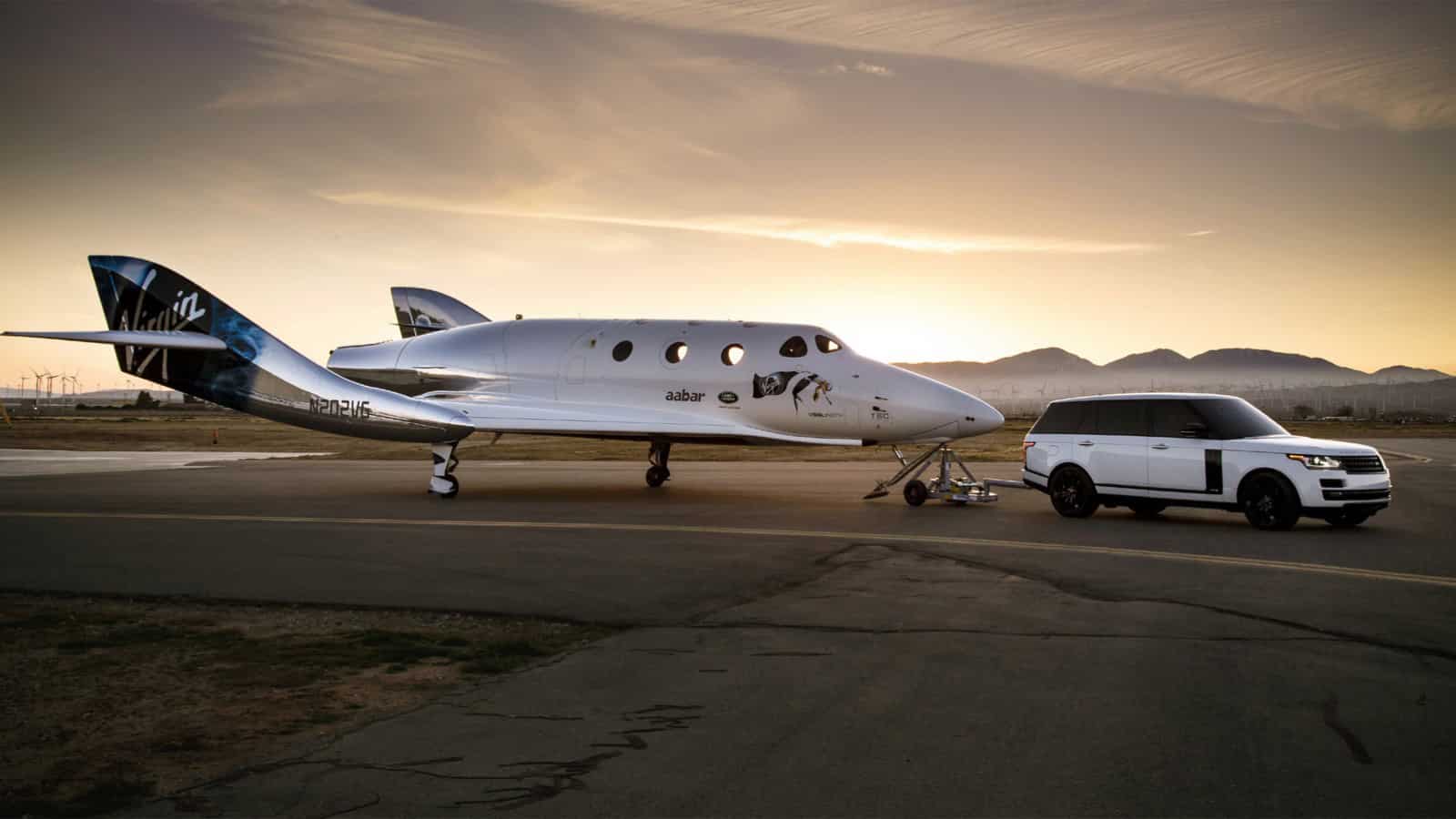 Virgin airplane with white range rover