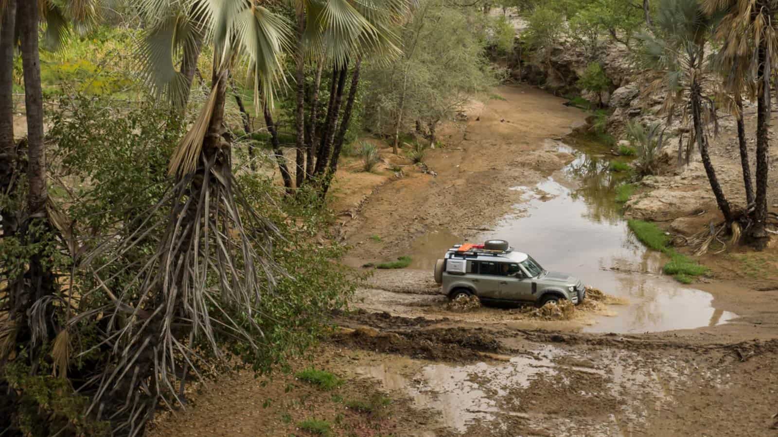 Range Rover driving through the mud 